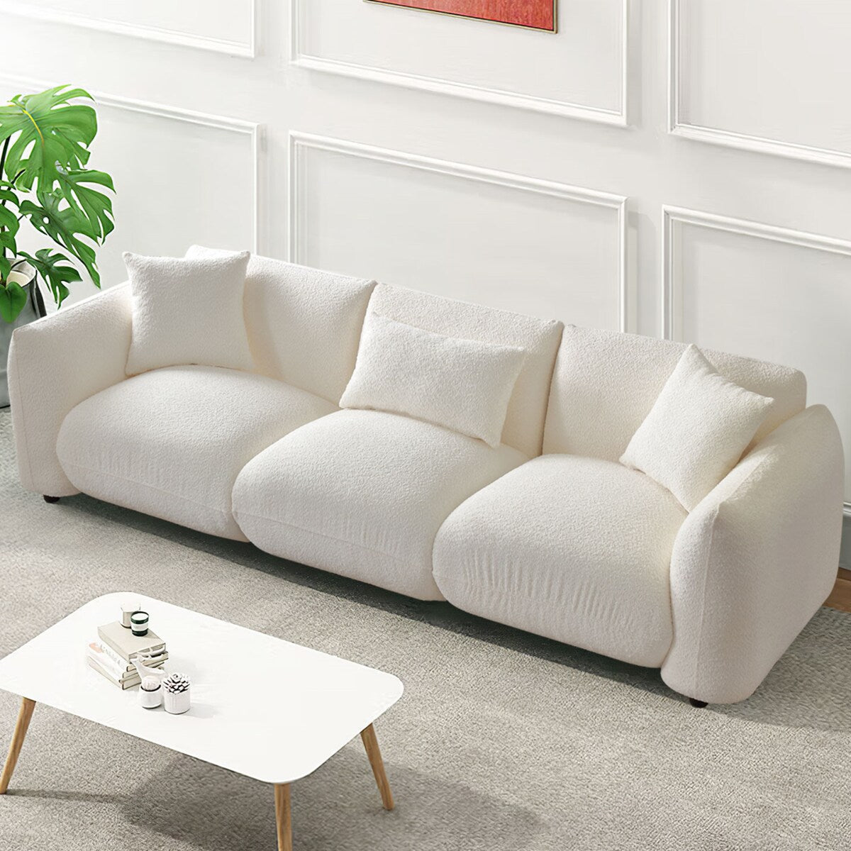 Canapé sectionnel blanc rembourré et confortable en duvet d'agneau doux avec pouf