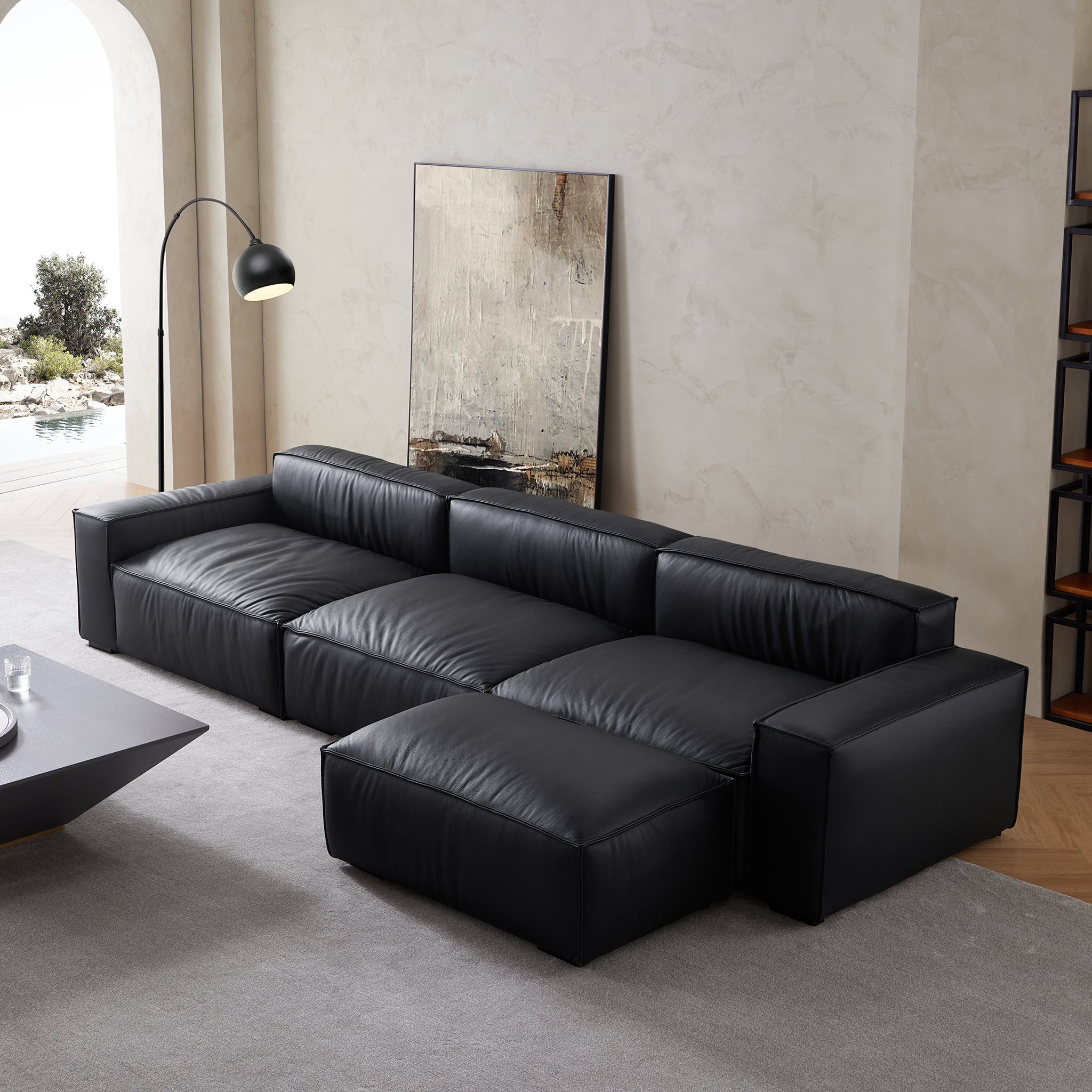 Canapé et pouf en cuir noir minimaliste de luxe