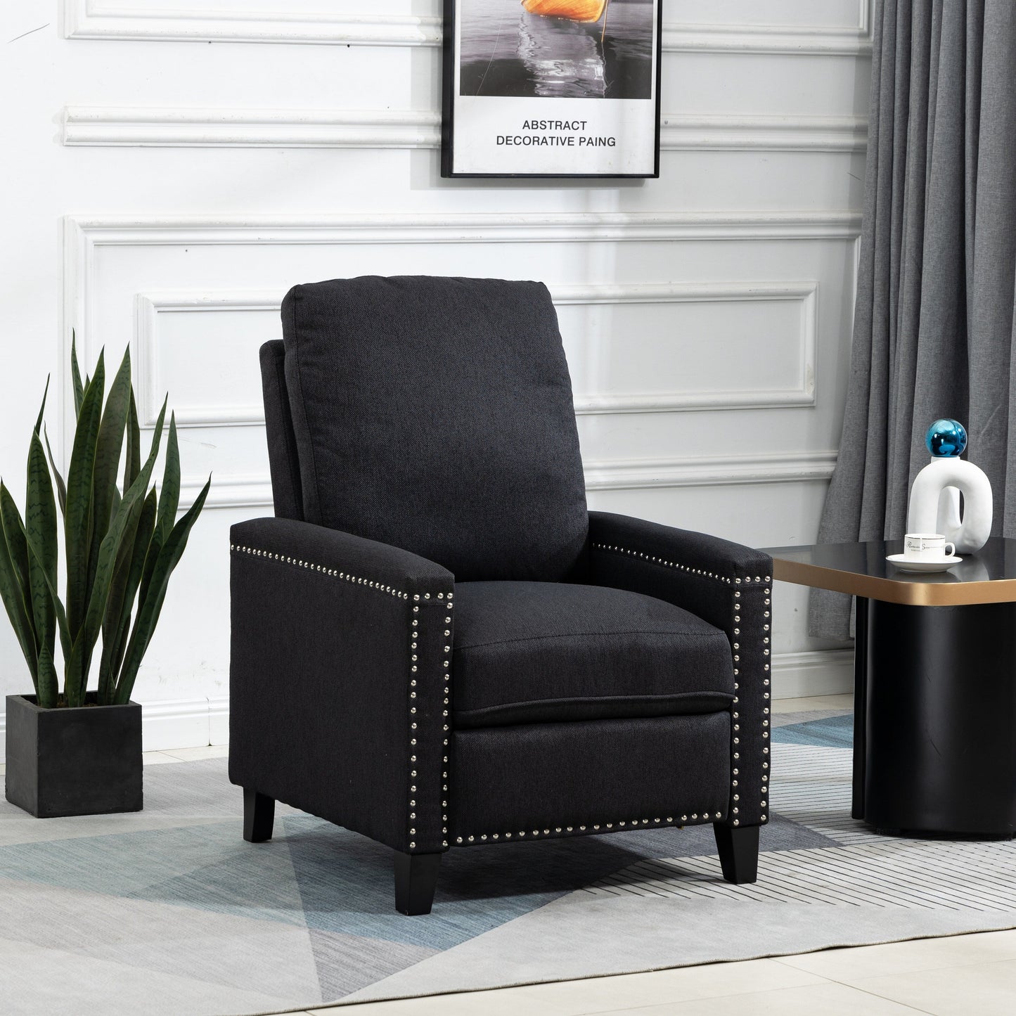 Fauteuil inclinable manuel moderne en velours noir avec coussins et décoration cloutée