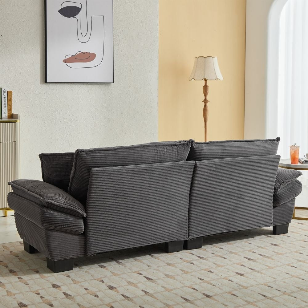 Canapé à assise profonde rembourré en velours côtelé