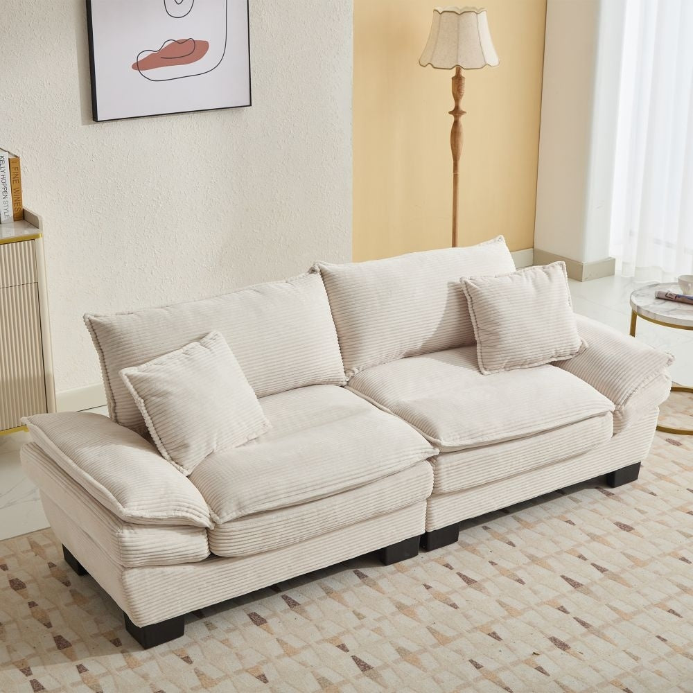 Canapé à assise profonde rembourré en velours côtelé