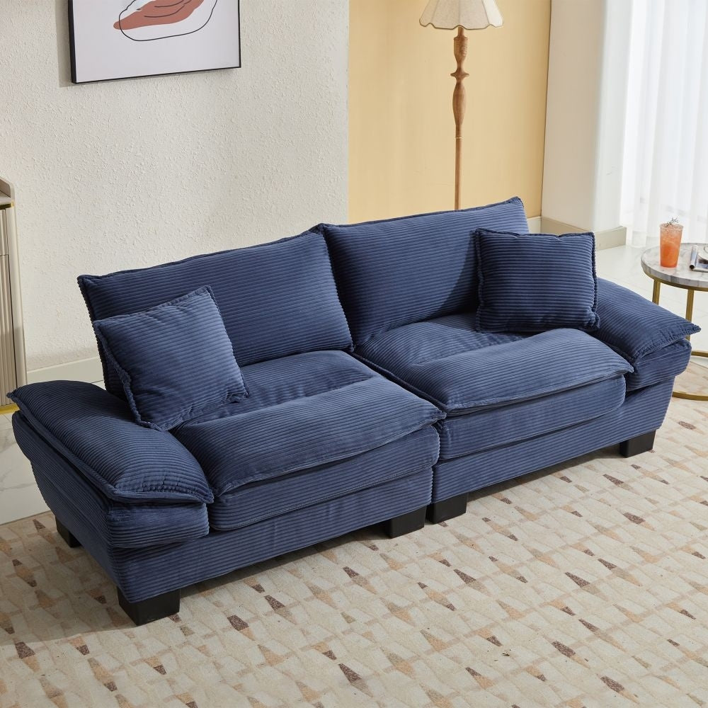 Canapé à assise profonde rembourré en velours côtelé