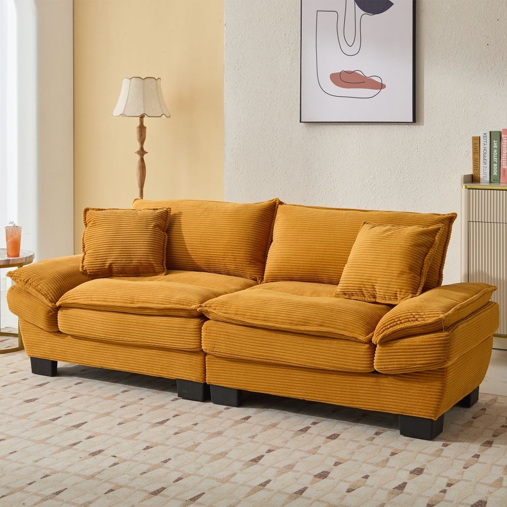 Canapé à assise profonde rembourré en velours côtelé