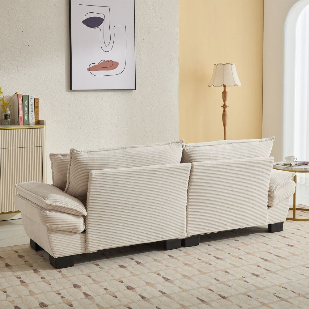 Canapé à assise profonde rembourré en velours côtelé