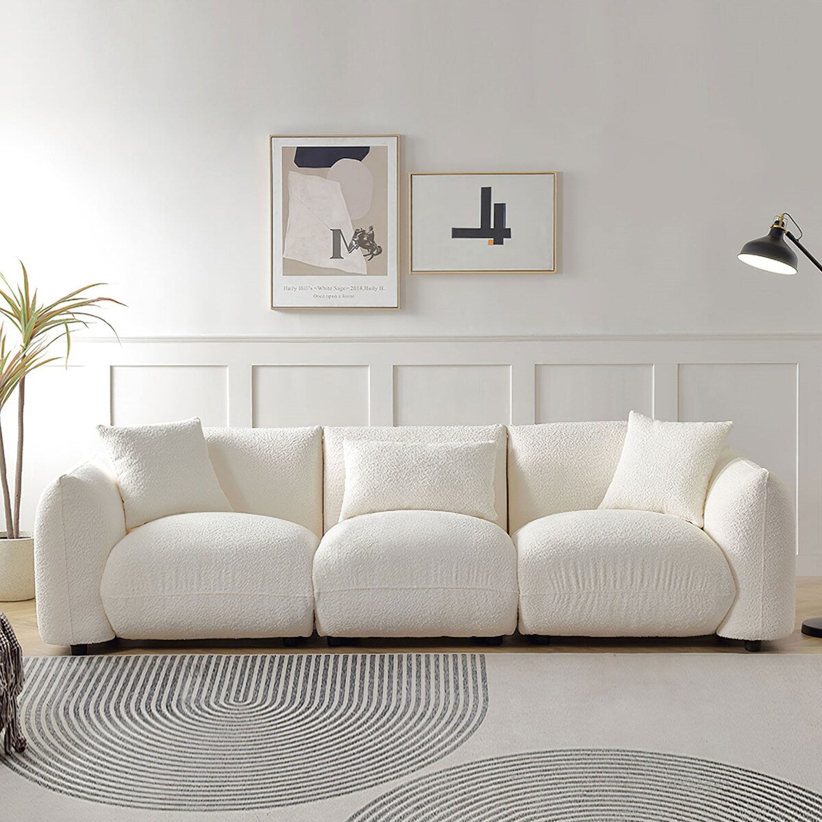 Canapé sectionnel blanc rembourré et confortable en duvet d'agneau doux avec pouf