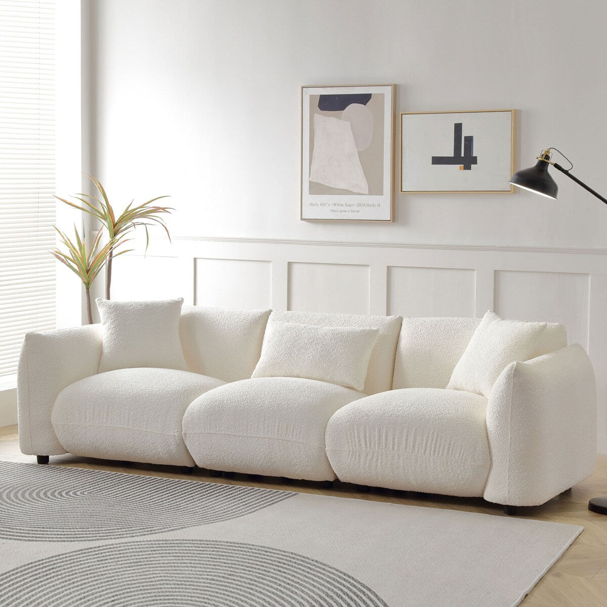 Canapé sectionnel blanc rembourré et confortable en duvet d'agneau doux avec pouf