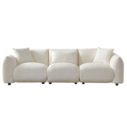Canapé sectionnel blanc rembourré et confortable en duvet d'agneau doux avec pouf