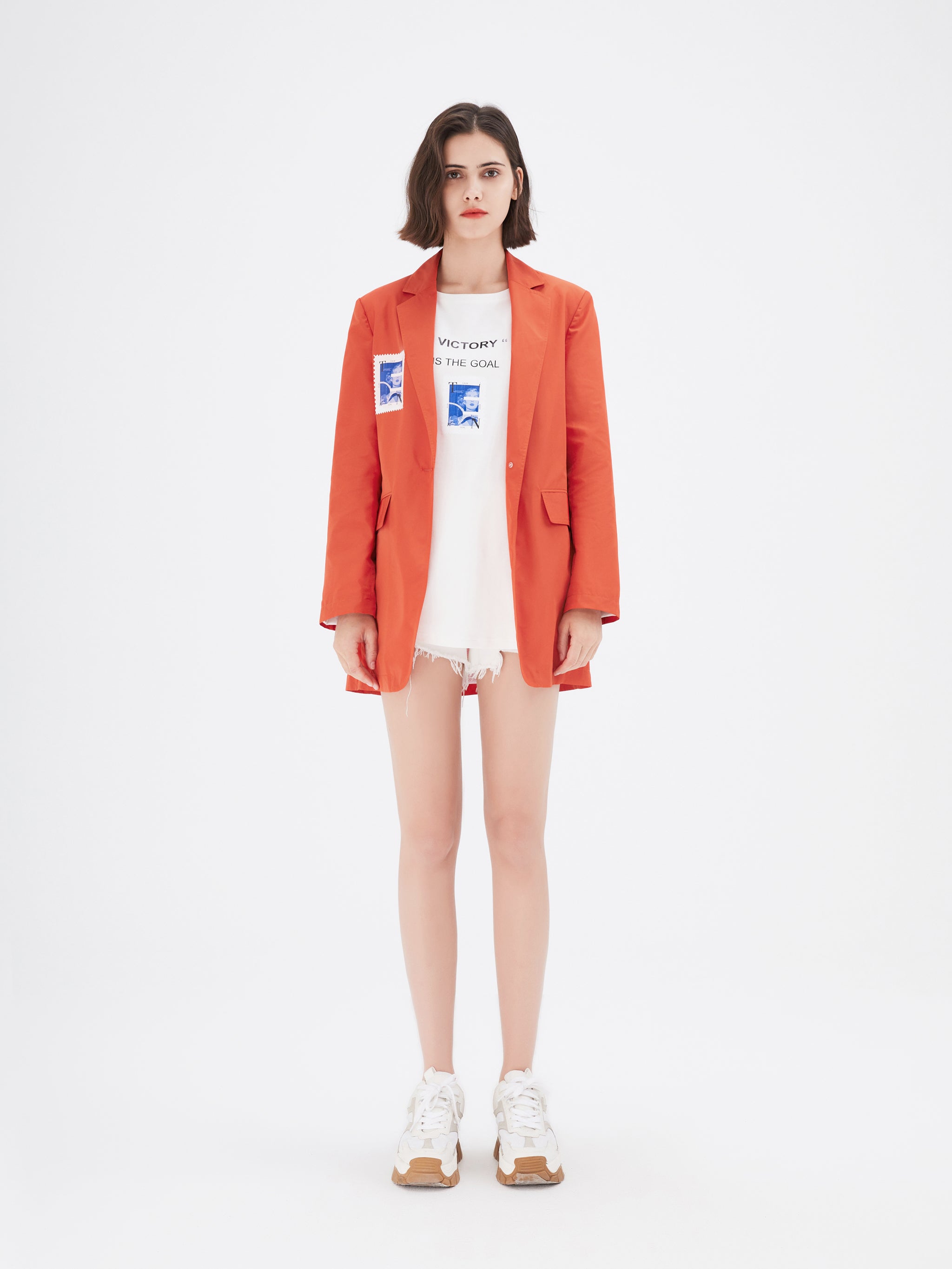 Blazer orange à imprimé graphique et boutonnage simple