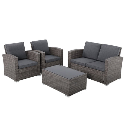 Salon de jardin en rotin pour 4 personnes avec coussins gris et table en verre trempé
