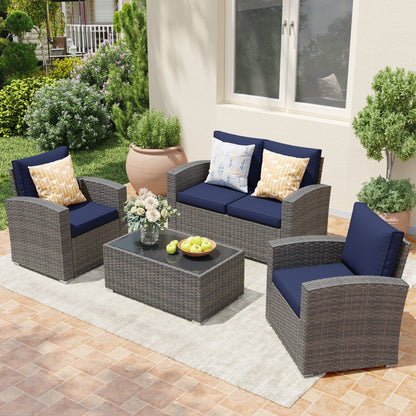 Salon de jardin en rotin pour 4 personnes avec coussins gris et table en verre trempé