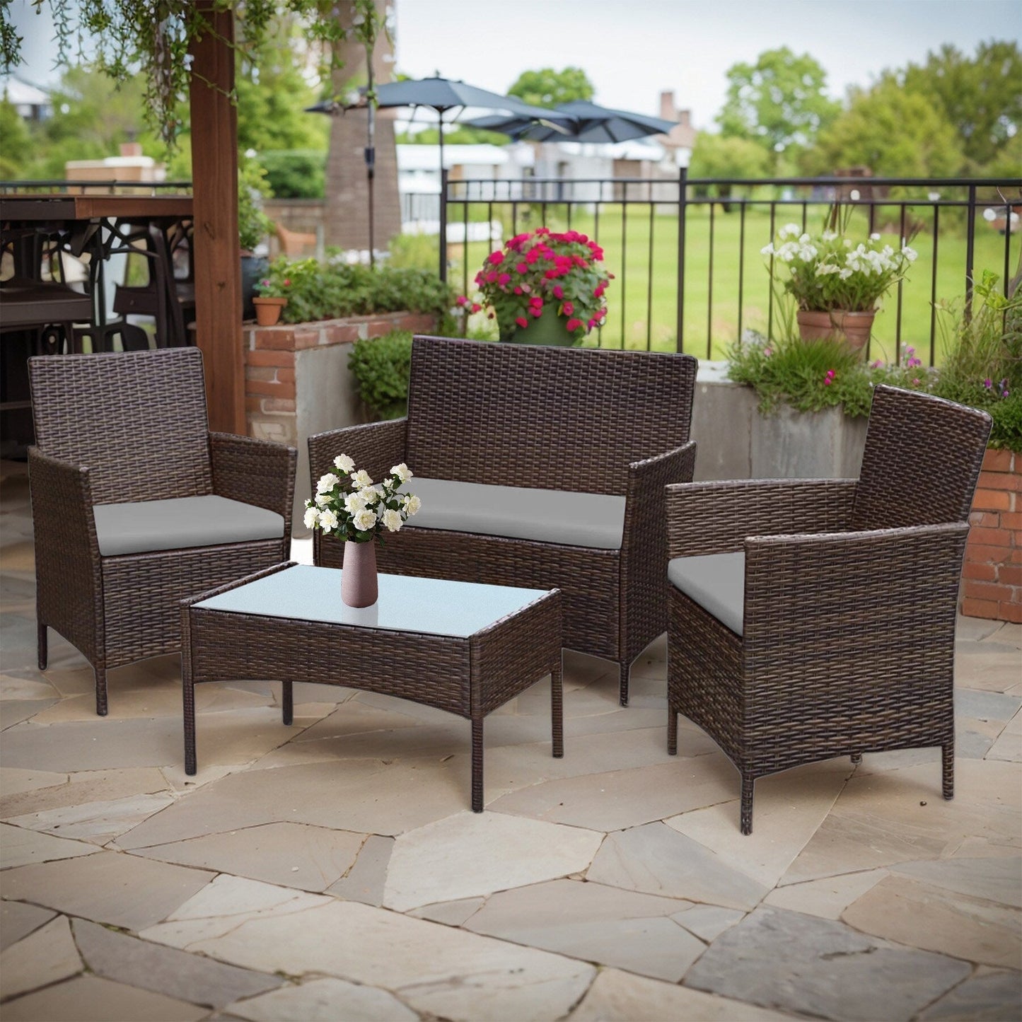 Ensemble de meubles de jardin 4 pièces avec coussins, salon de jardin en osier et table basse en verre