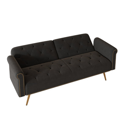 Un canapé-lit de 176 cm de long recouvert de velours, orné d'une bordure cloutée et accompagné d'un coussin assorti.