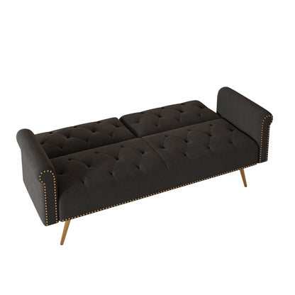 Un canapé-lit de 176 cm de long recouvert de velours, orné d'une bordure cloutée et accompagné d'un coussin assorti.