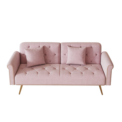Un canapé-lit de 176 cm de long recouvert de velours, orné d'une bordure cloutée et accompagné d'un coussin assorti.