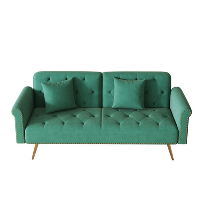 Un canapé-lit de 176 cm de long recouvert de velours, orné d'une bordure cloutée et accompagné d'un coussin assorti.