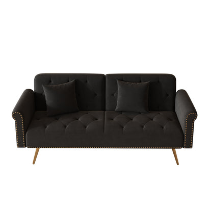 Un canapé-lit de 176 cm de long recouvert de velours, orné d'une bordure cloutée et accompagné d'un coussin assorti.