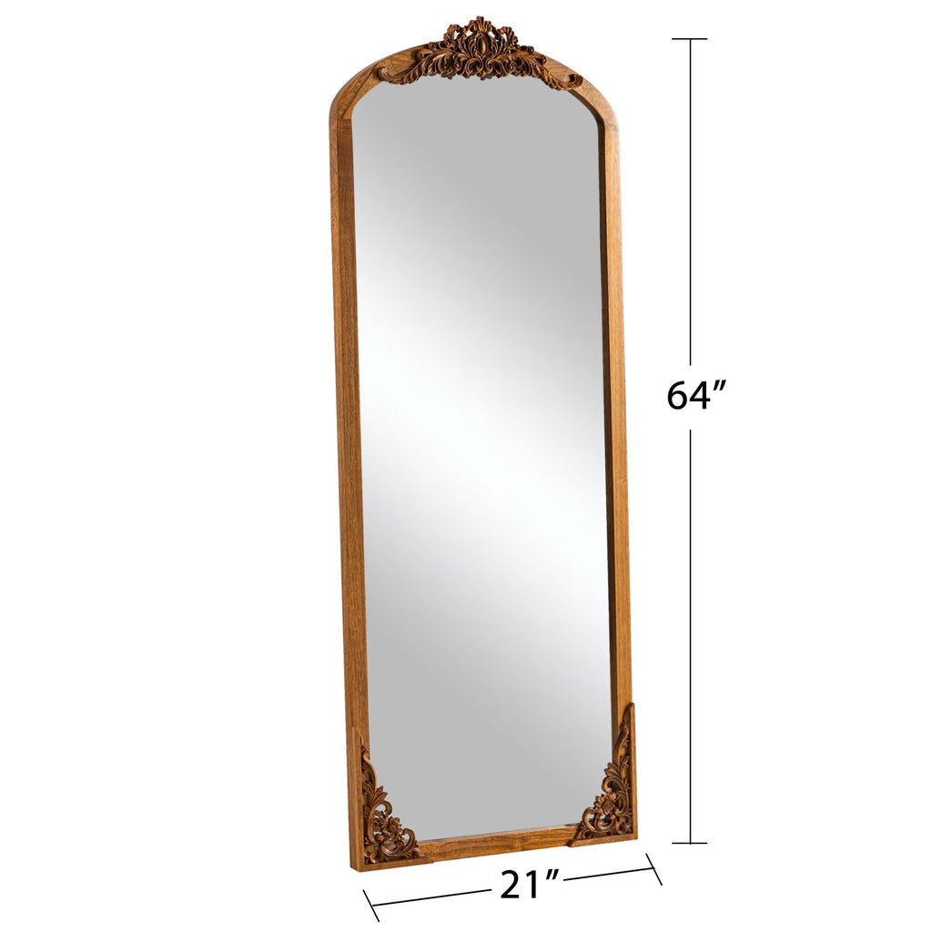Miroir de sol sculpté en bois massif de forme arquée sur toute la longueur