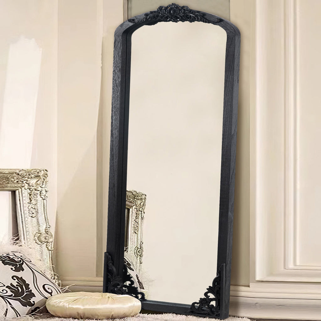 Miroir de sol sculpté en bois massif de forme arquée sur toute la longueur