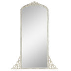 Miroir de sol sculpté en bois massif de forme arquée sur toute la longueur