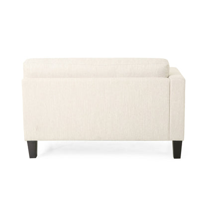 Canapé 3 places beige avec pieds en bois et deux coussins