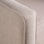 Fauteuil inclinable rembourré en tissu beige de style milieu du siècle avec repose-pieds, dossier capitonné et pieds en hêtre