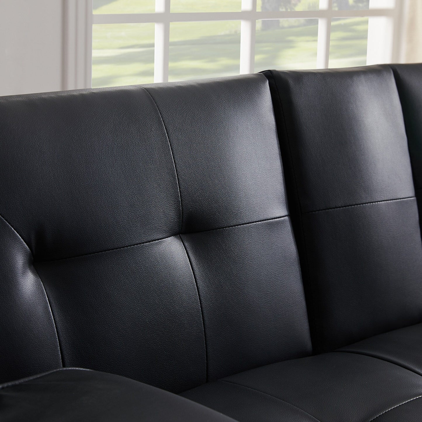 Canapé-lit convertible en similicuir noir avec porte-gobelets. Dimensions : 31,50 x 65,75 x 29,53 cm.