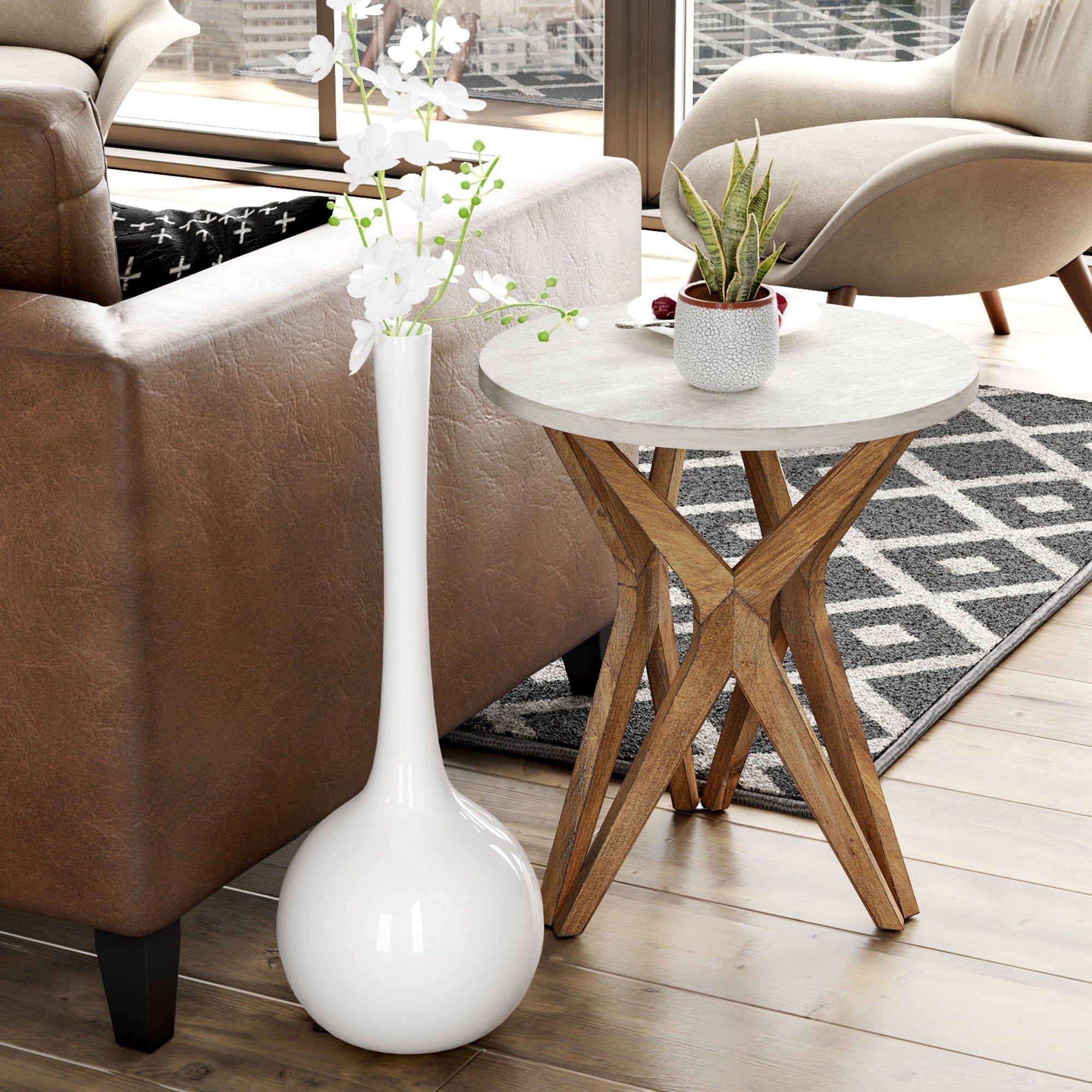 Table d'appoint ronde style campagnard avec piédestal et base vieillie pour une décoration de style campagnard moderne et bohème.