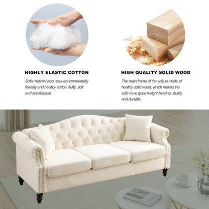 Canapé Chesterfield 3 places capitonné avec accoudoirs roulés et clous décoratifs