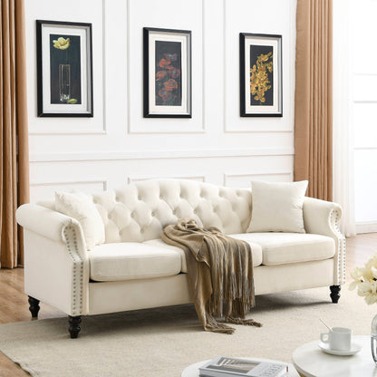 Canapé Chesterfield 3 places capitonné avec accoudoirs roulés et clous décoratifs