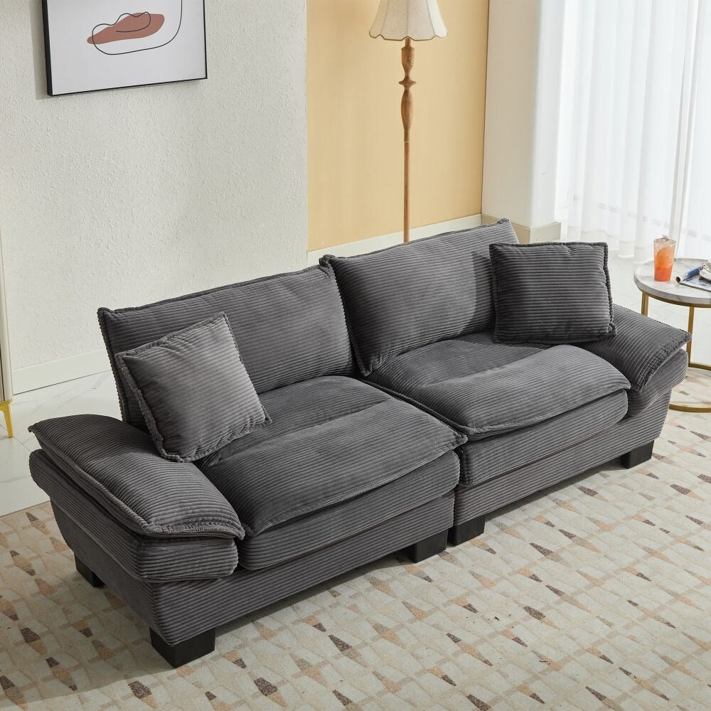 Canapé à assise profonde rembourré en velours côtelé