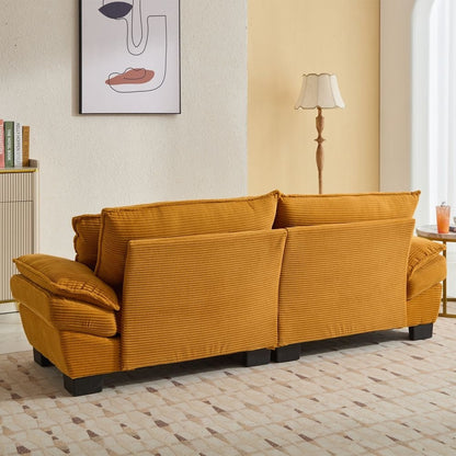 Canapé à assise profonde rembourré en velours côtelé