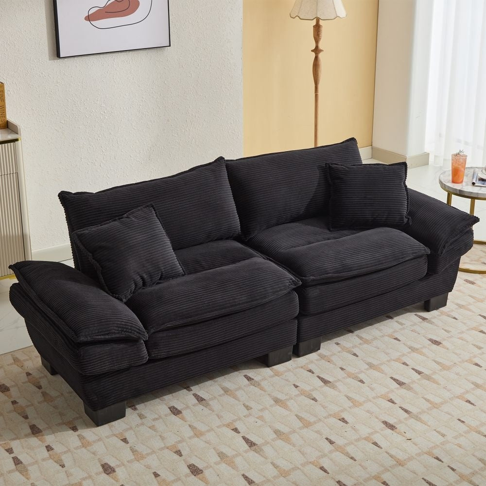 Canapé à assise profonde rembourré en velours côtelé