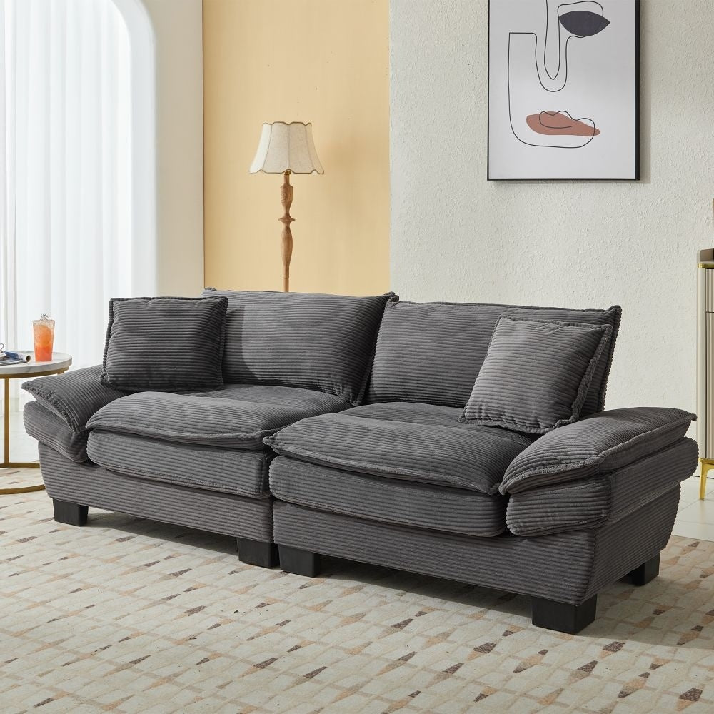 Canapé à assise profonde rembourré en velours côtelé
