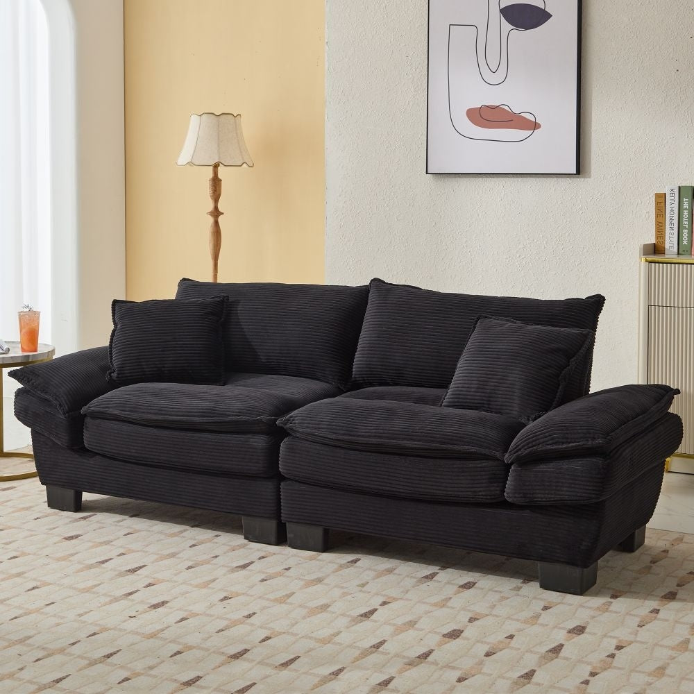 Canapé à assise profonde rembourré en velours côtelé
