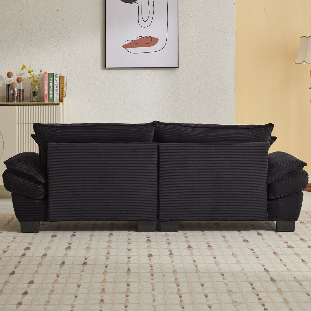 Canapé à assise profonde rembourré en velours côtelé