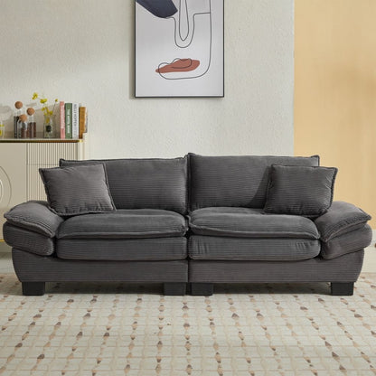 Canapé à assise profonde rembourré en velours côtelé