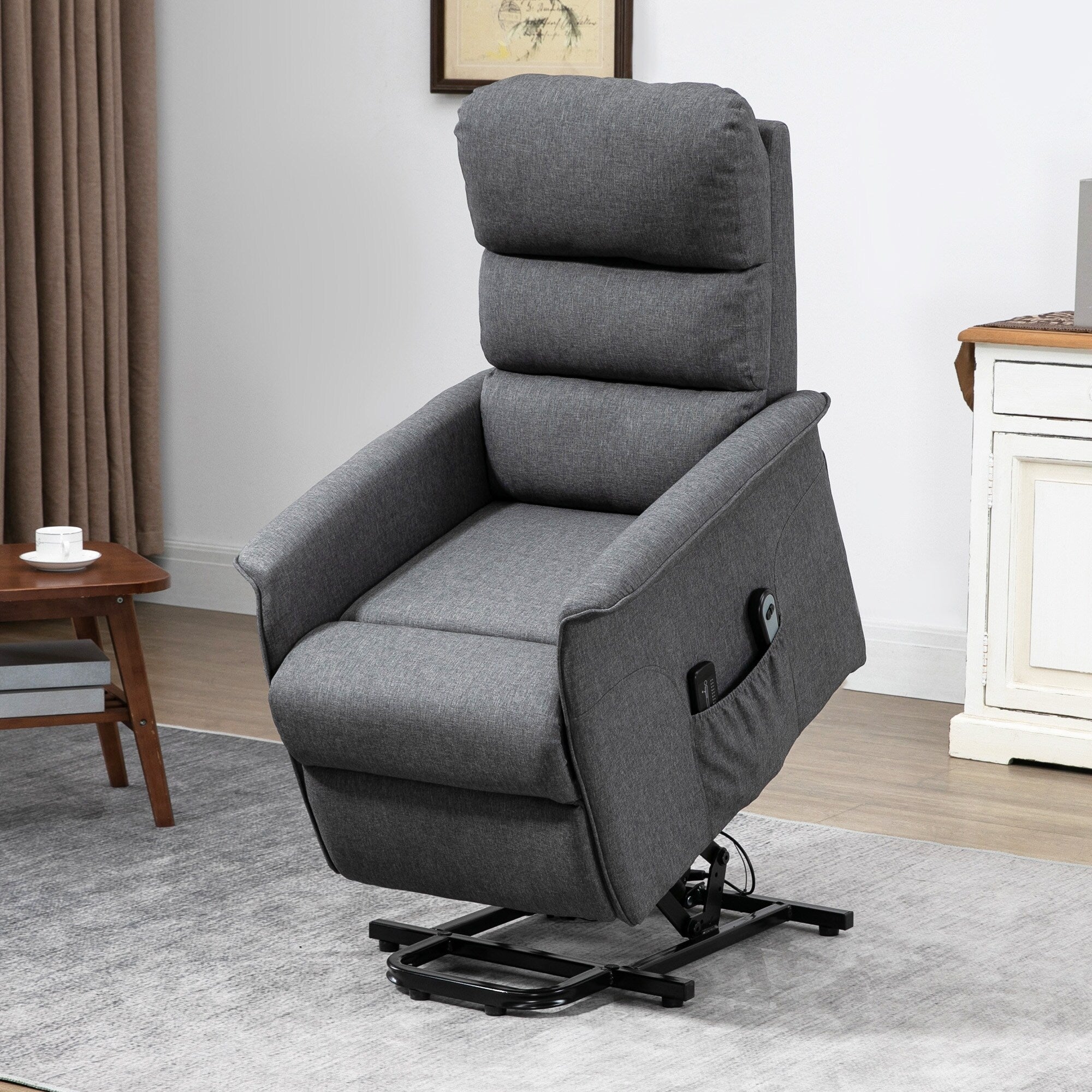 Fauteuil inclinable électrique en tissu gris avec massage lombaire par vibration, télécommande et poches latérales
