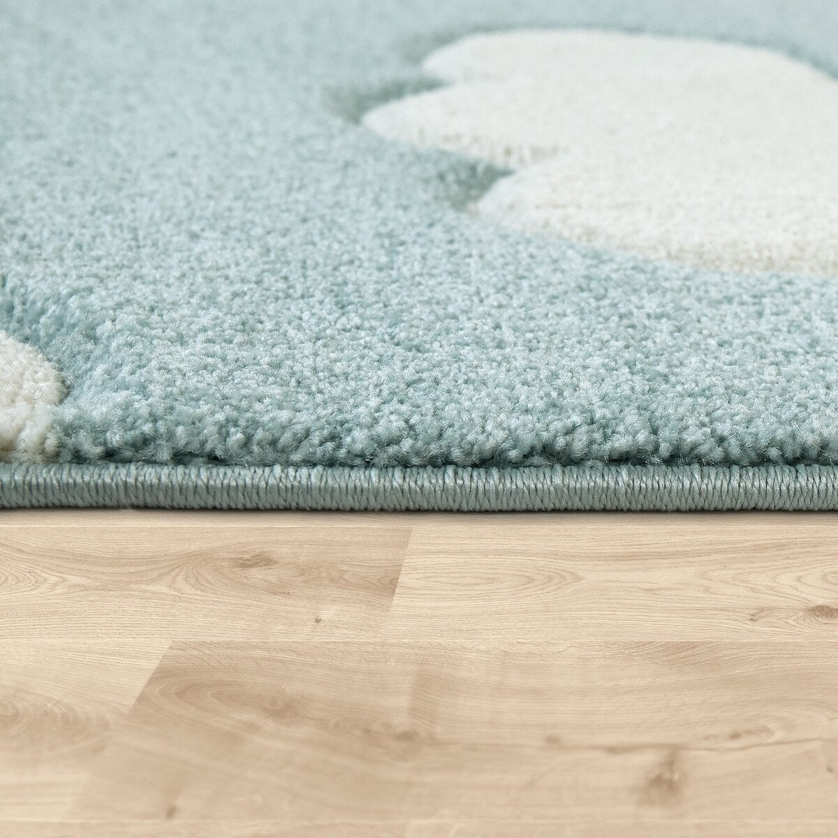 Tapis pour chambre d'enfant ou crèche aux couleurs pastel avec nuages