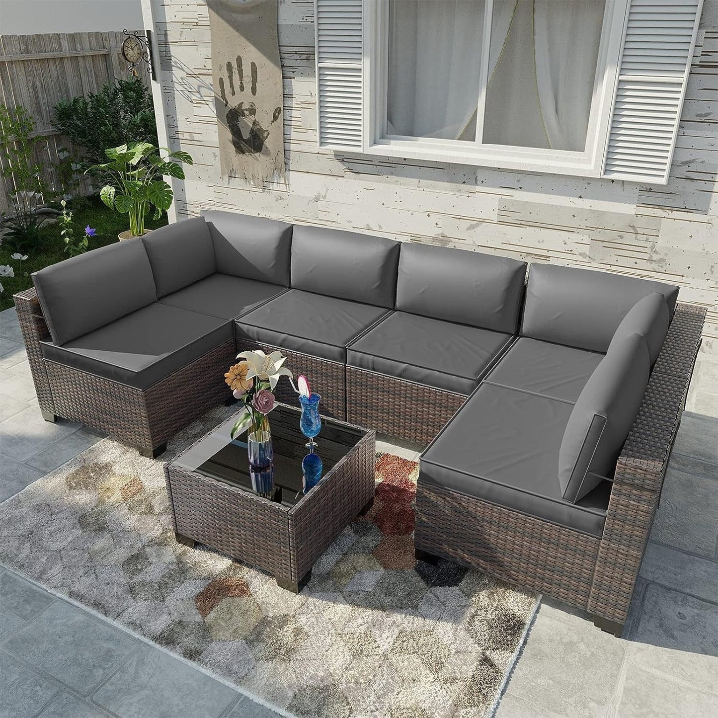 Ensemble de canapés d'extérieur sectionnels Kullavik 7 pièces en osier marron avec coussins d'assise et table en verre trempé