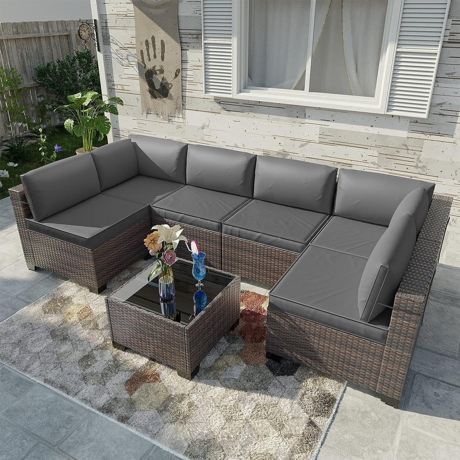 Ensemble de canapés d'extérieur sectionnels Kullavik 7 pièces en osier marron avec coussins d'assise et table en verre trempé