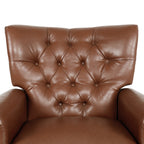 Fauteuil inclinable rembourré en cuir synthétique marron clair avec repose-pieds, dossier capitonné et détails cloutés
