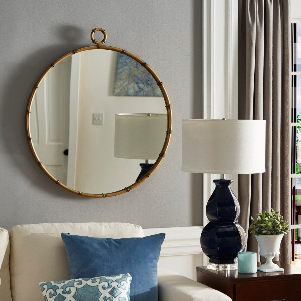 Miroir mural rond Marza finition laiton antique par iNSPIRE Q Modern