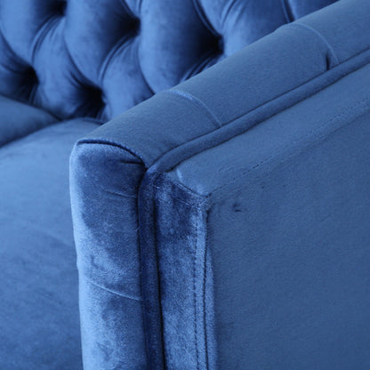 Canapé capitonné bleu marine avec pieds en bois