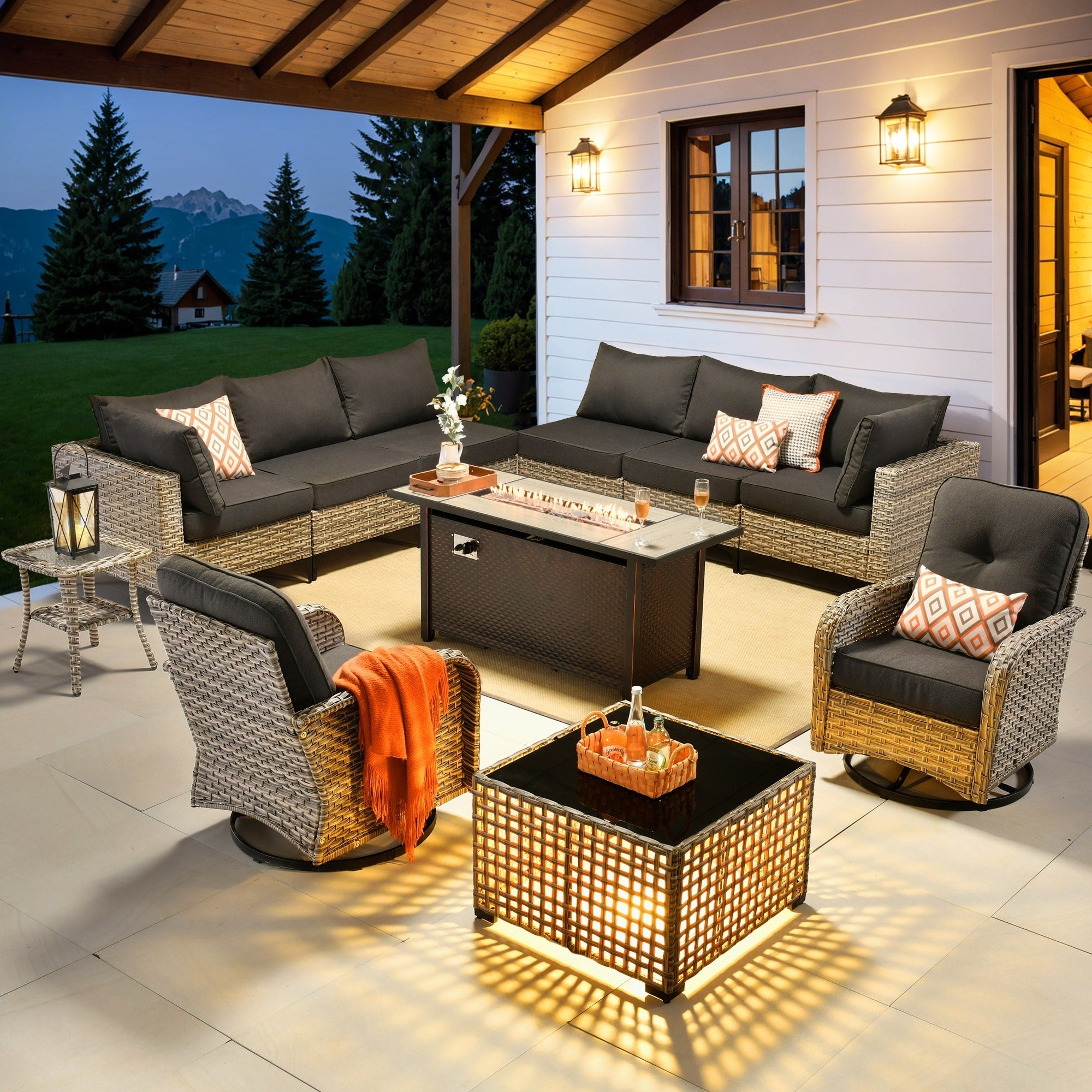 Ensemble de 11 chaises pivotantes d'extérieur en osier OVIOS avec table à feu