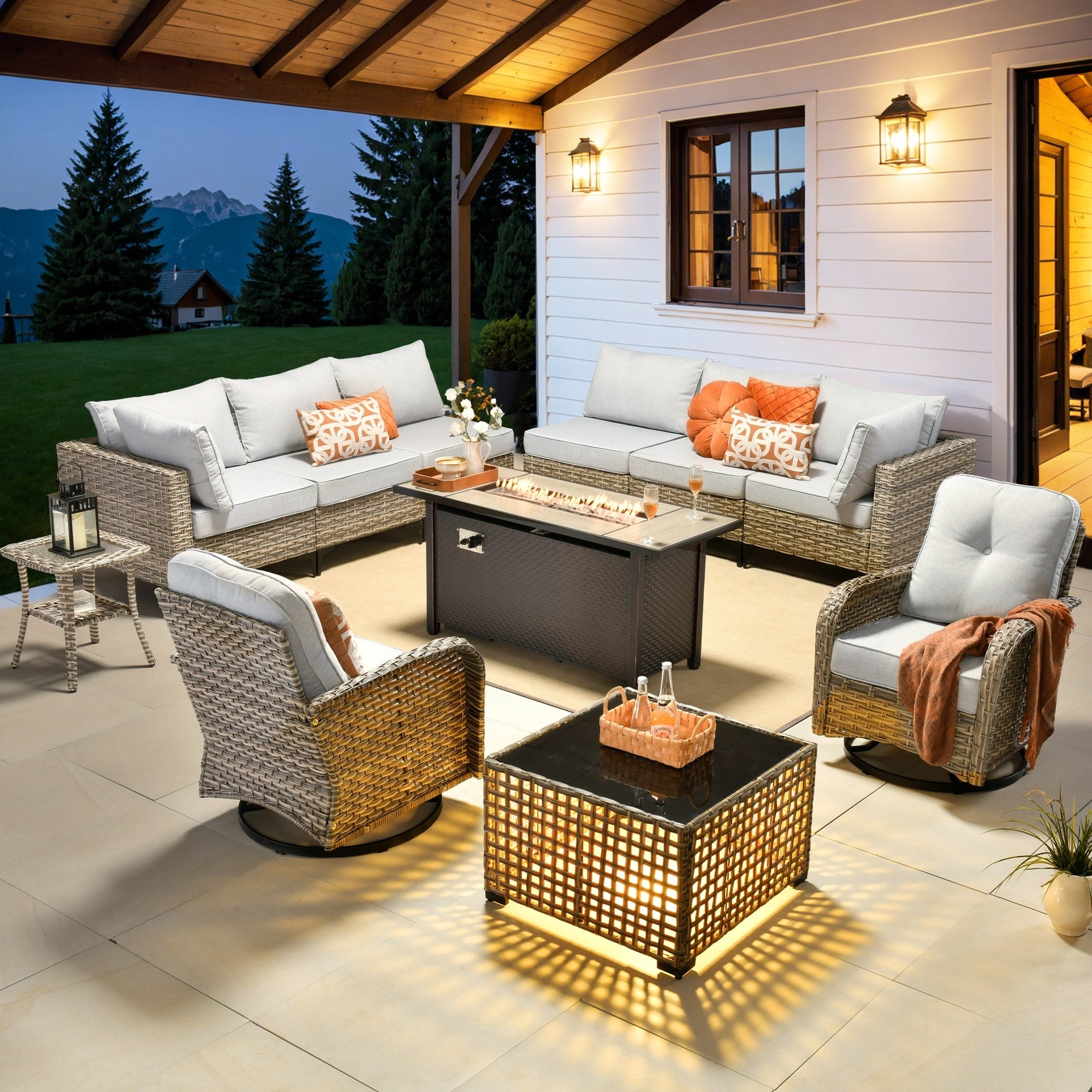 Ensemble de 11 chaises pivotantes d'extérieur en osier OVIOS avec table à feu