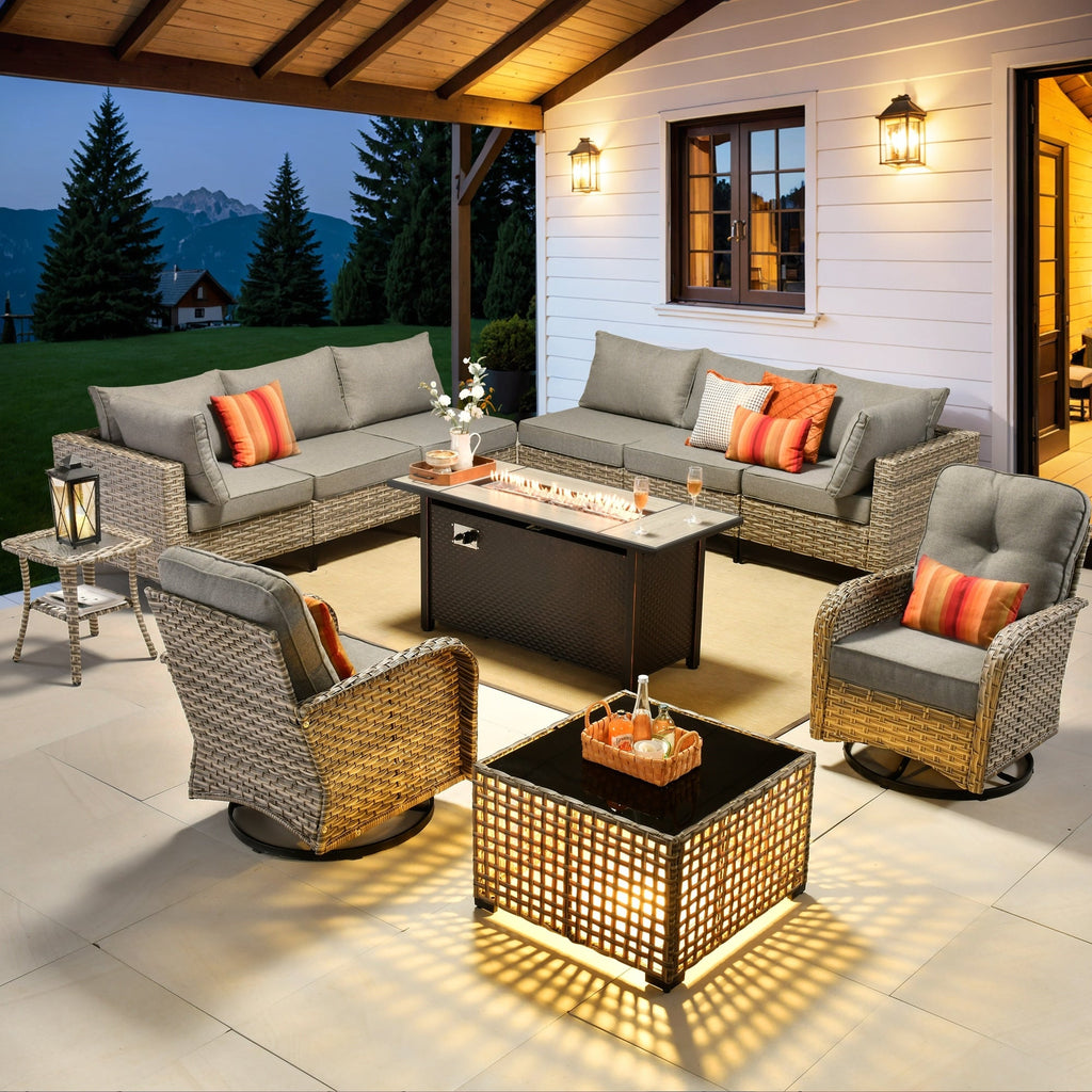Ensemble de 11 chaises pivotantes d'extérieur en osier OVIOS avec table à feu