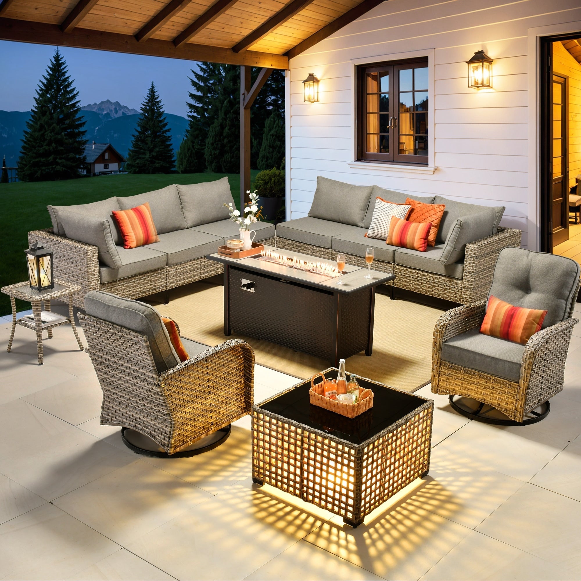 Ensemble de 11 chaises pivotantes d'extérieur en osier OVIOS avec table à feu