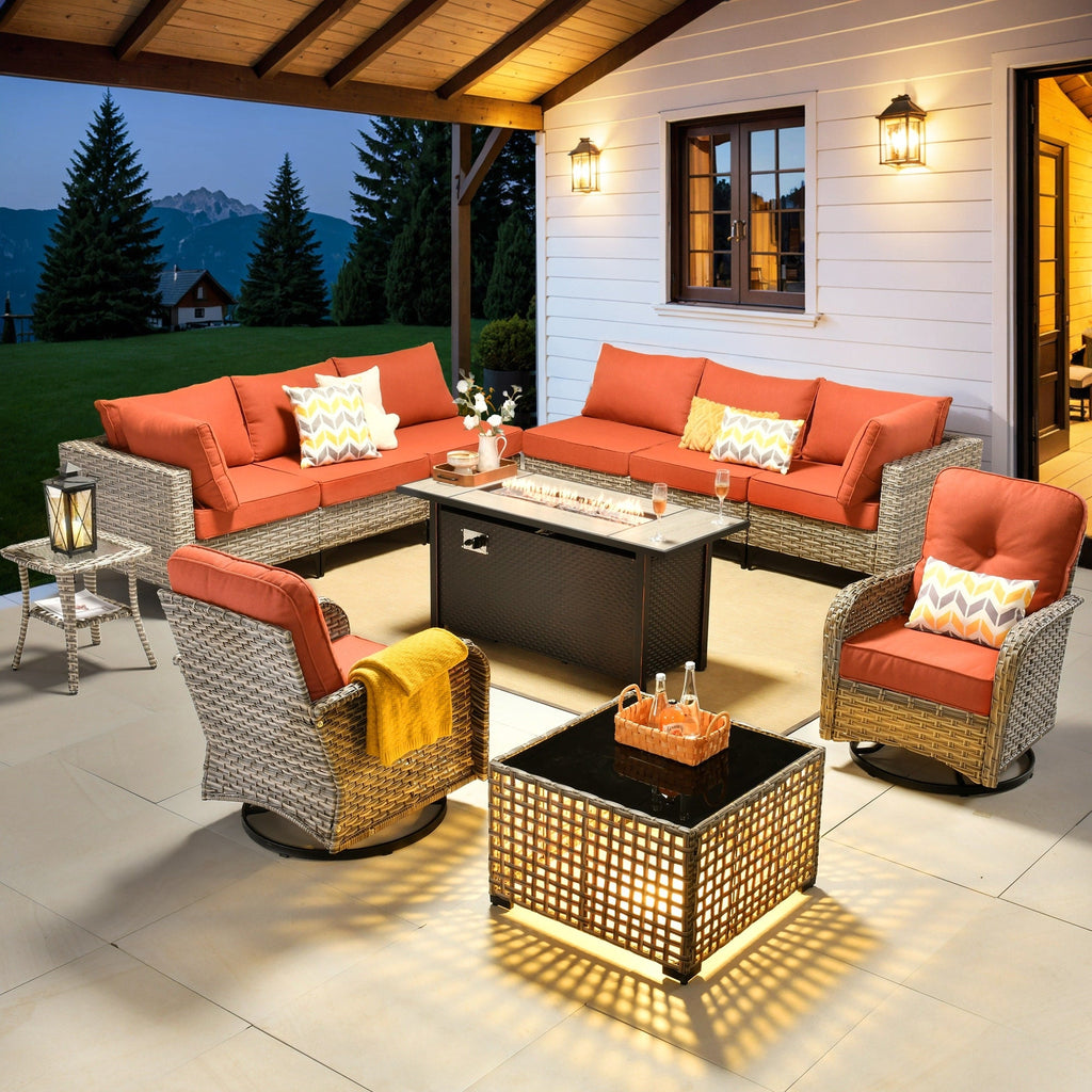 Ensemble de 11 chaises pivotantes d'extérieur en osier OVIOS avec table à feu