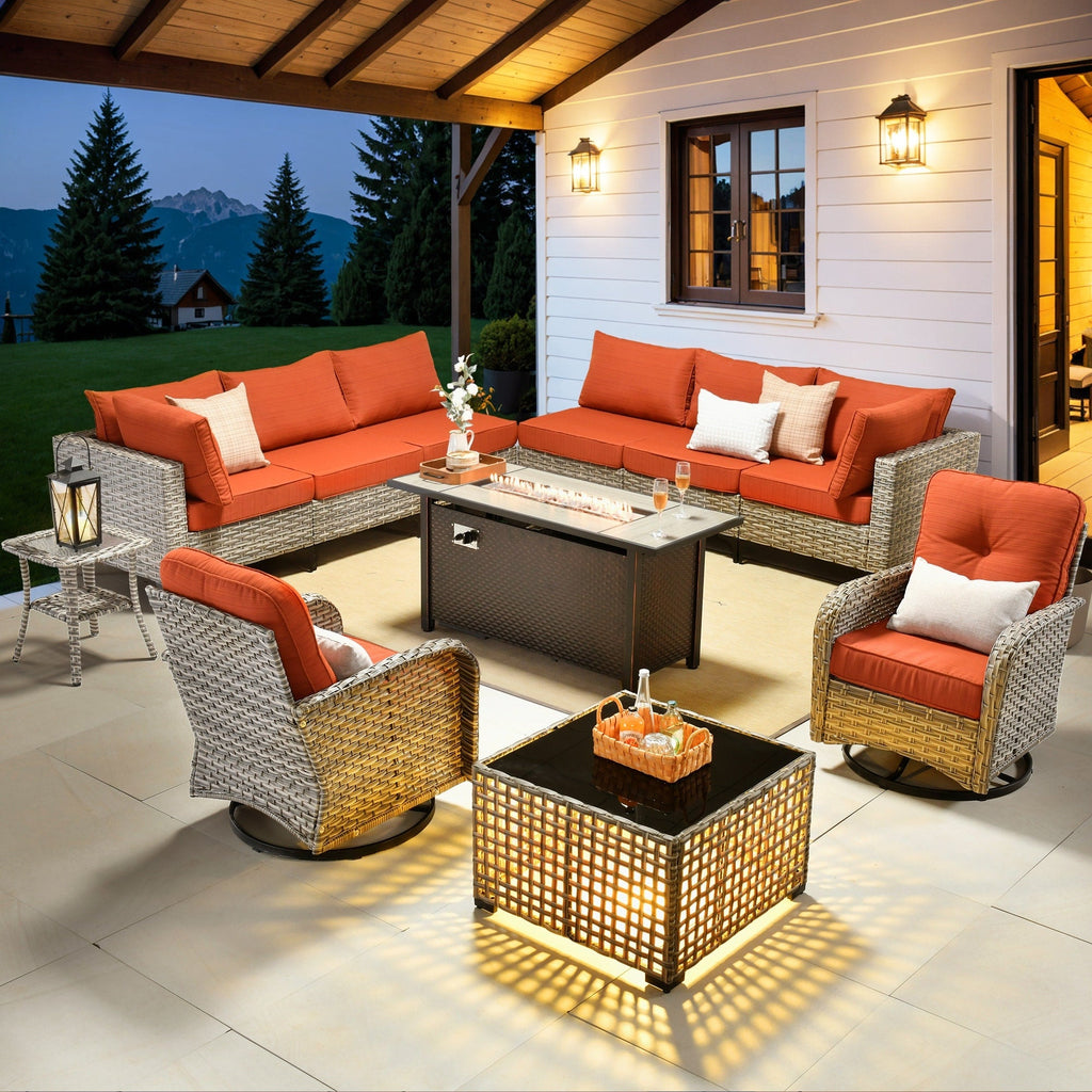 Ensemble de 11 chaises pivotantes d'extérieur en osier OVIOS avec table à feu