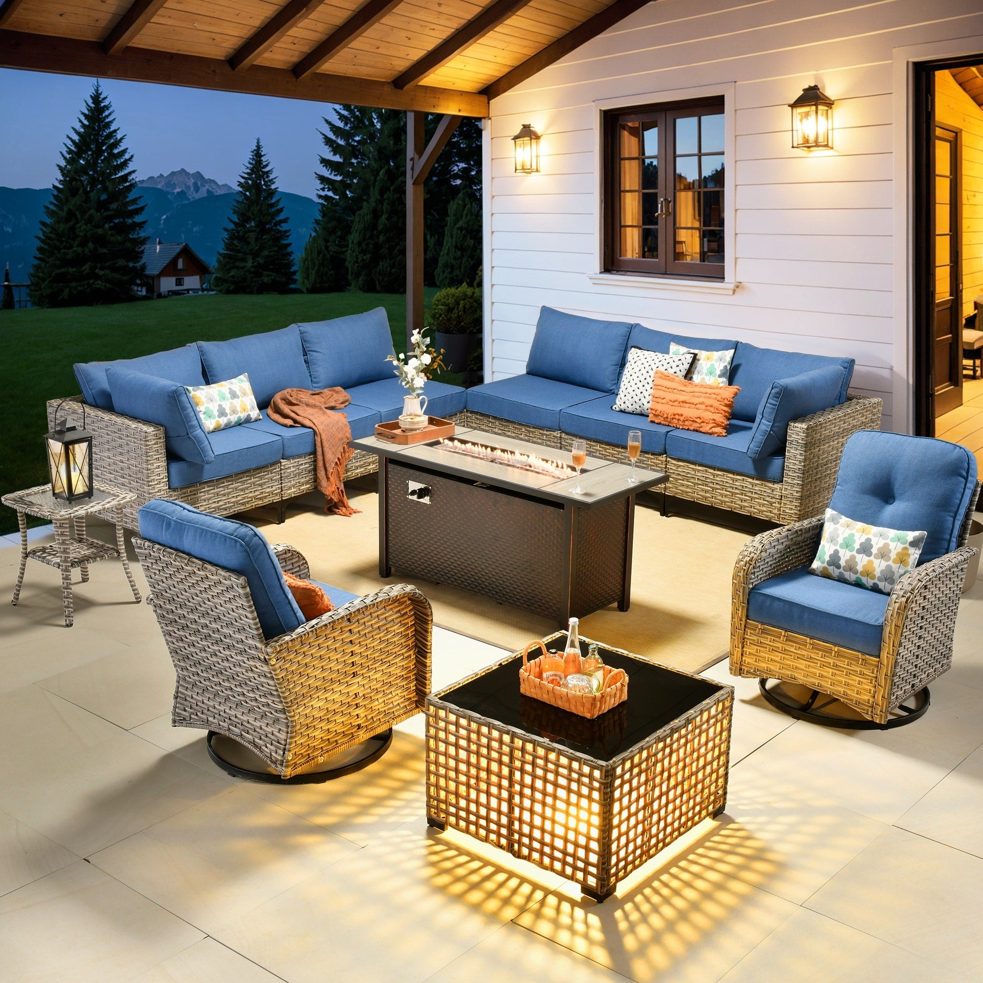 Ensemble de 11 chaises pivotantes d'extérieur en osier OVIOS avec table à feu